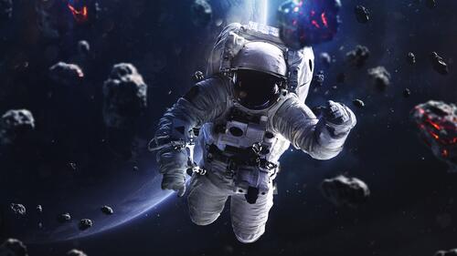 Astronaut in weightlessness among asteroids