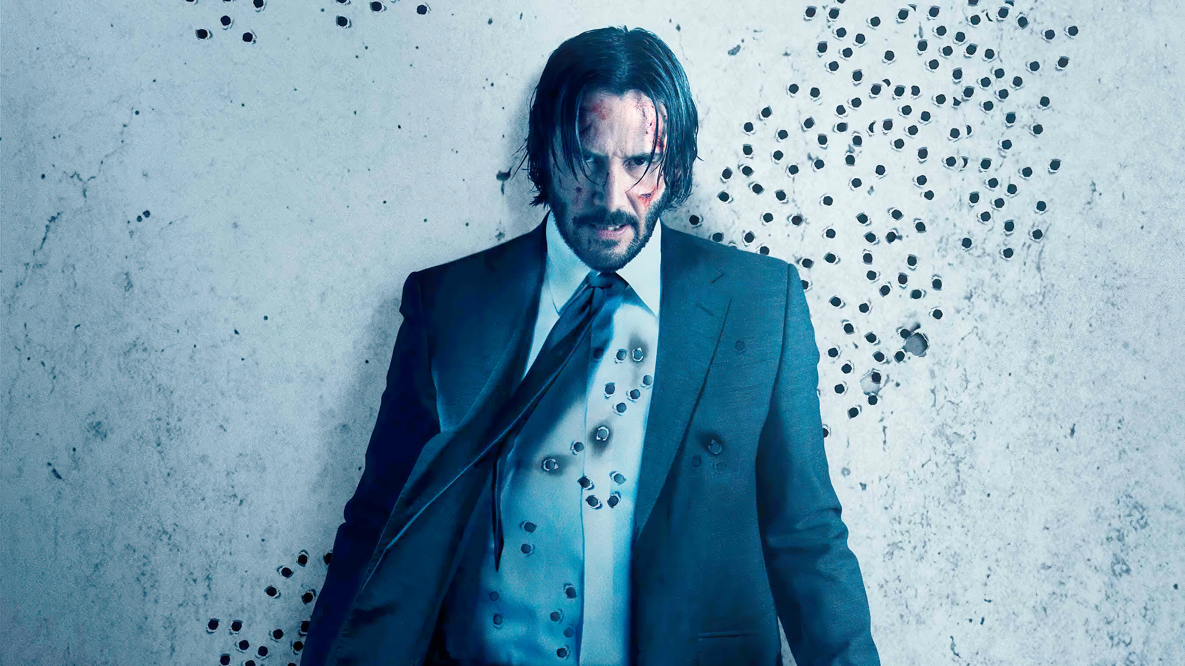 Free photo John Wick stands at the shot wall