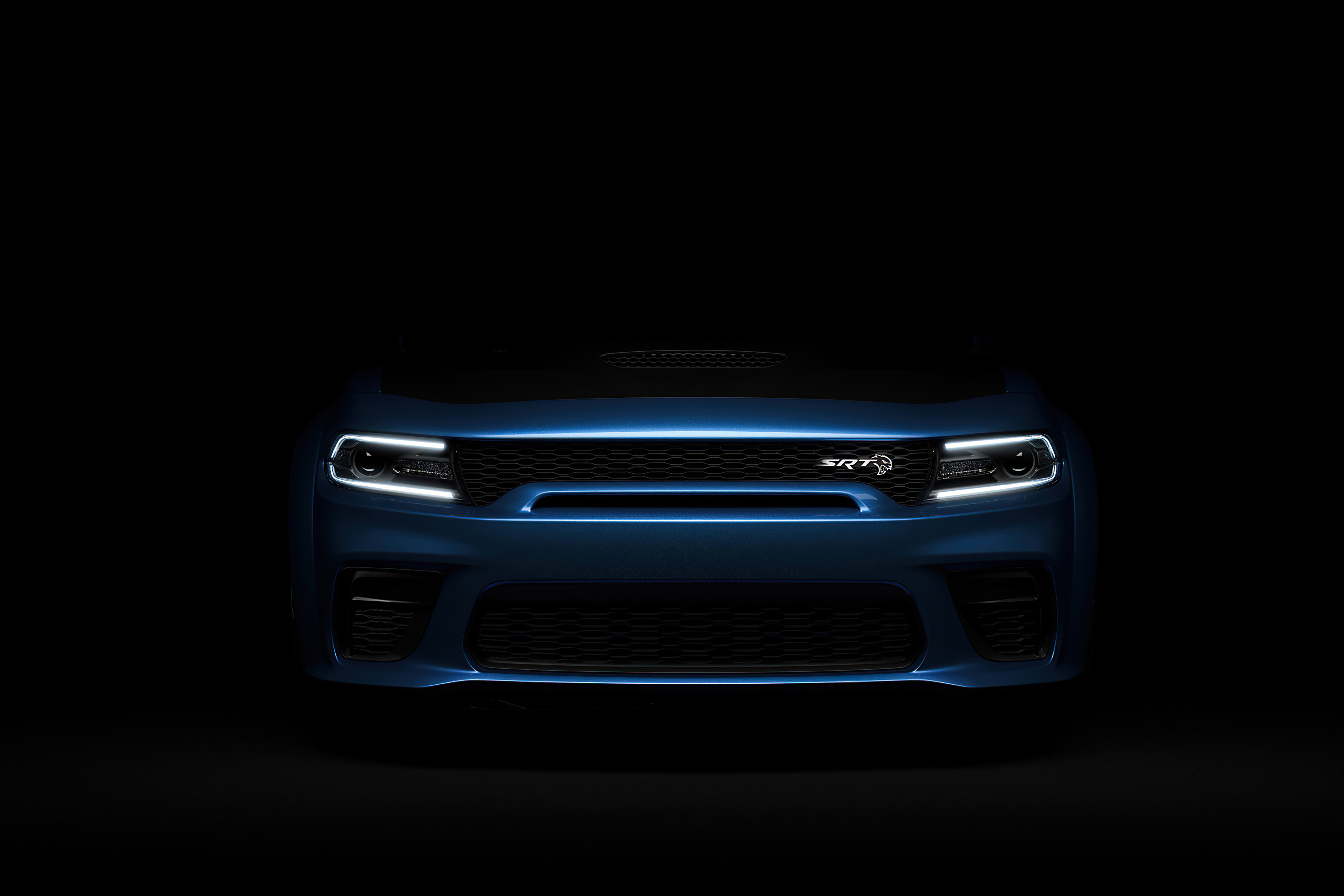 Dodge Challenger Srt Hellcat Widebody silhouette in the dark.