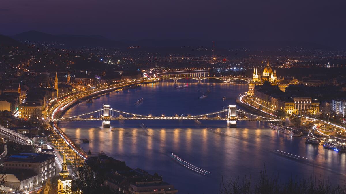 Budapest at night in Hungary with a bridge over the river