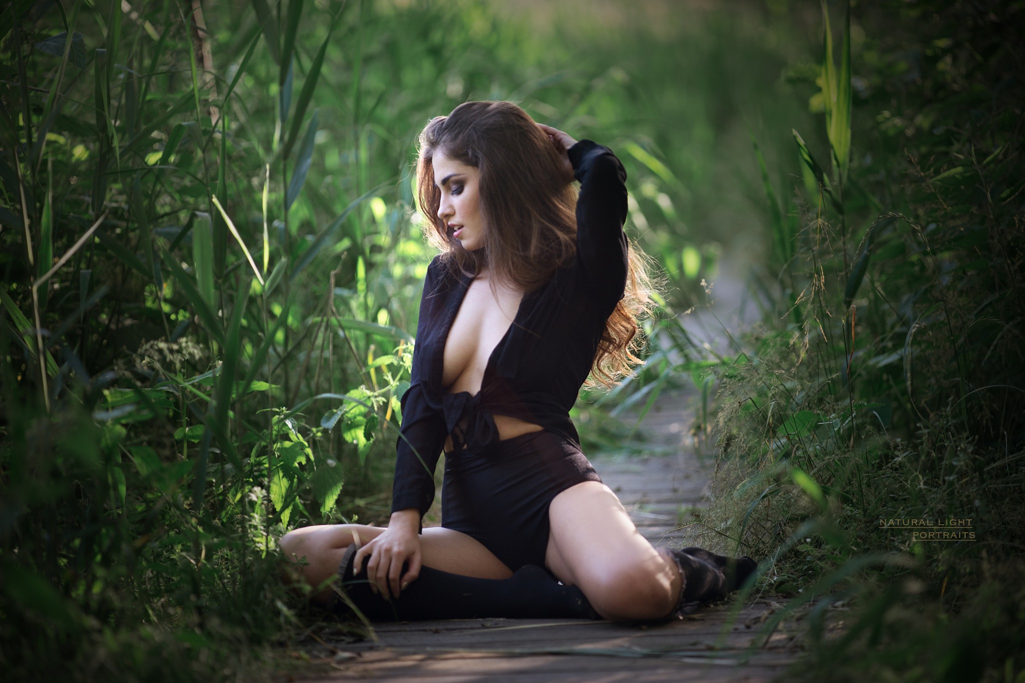 Free photo Picture of a girl in black lingerie in nature