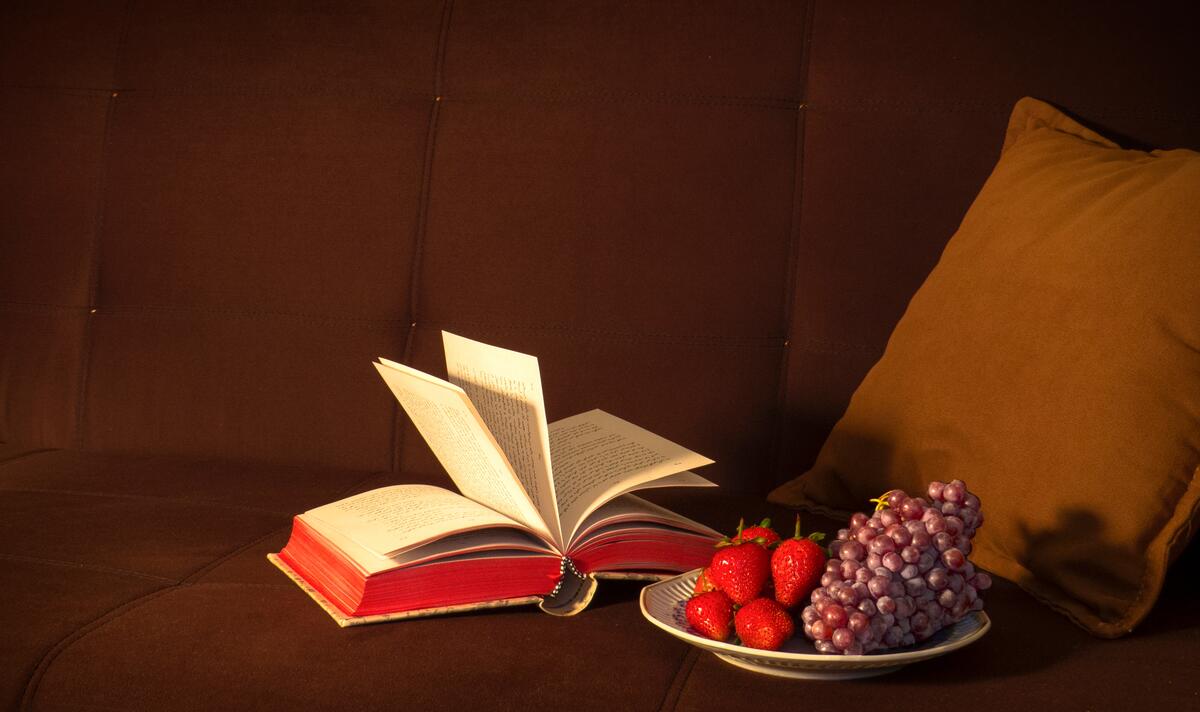 Open book with a plate of fresh berries