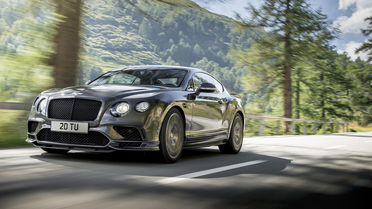 Gray 2018 Bentley Continental in motion