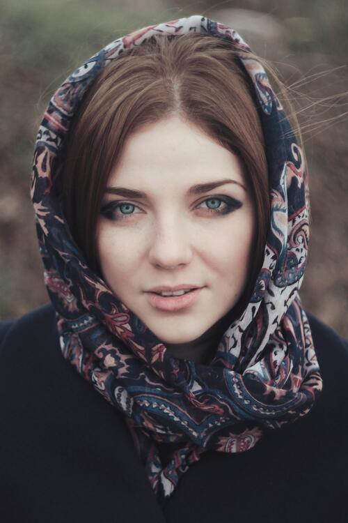 Portrait of a dark-haired girl in a headscarf