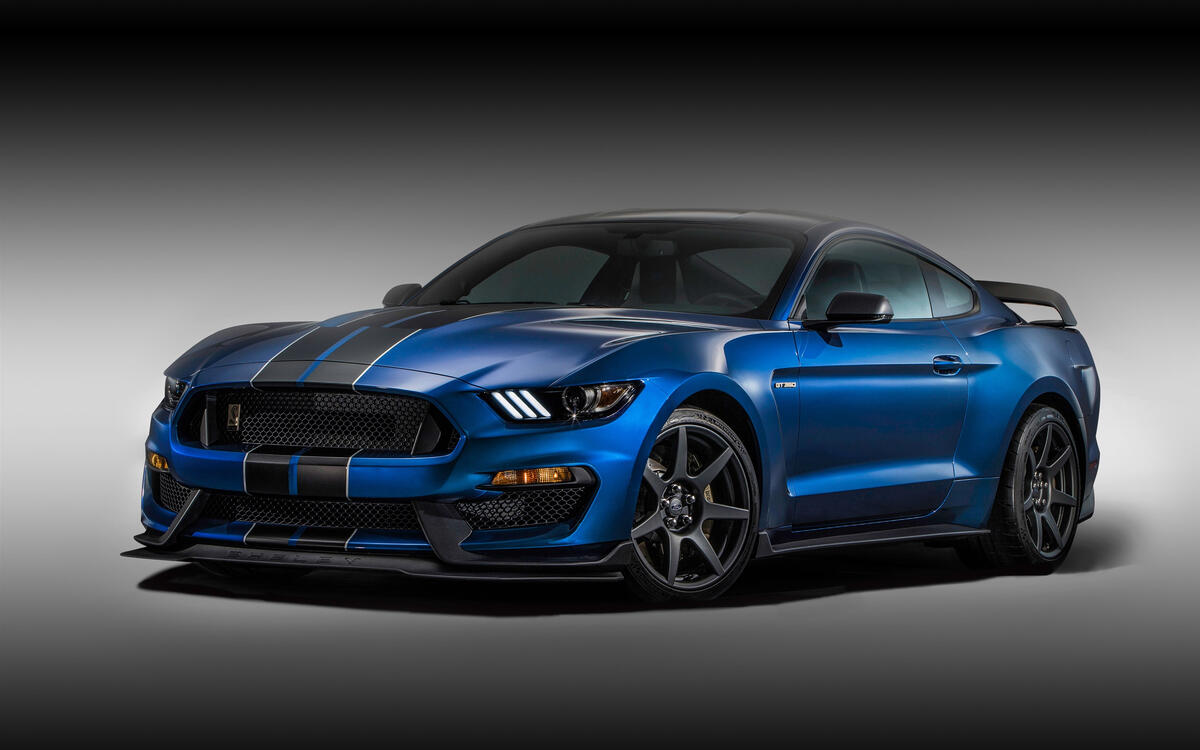 Blue ford mustang gt350r with black stripes on hood