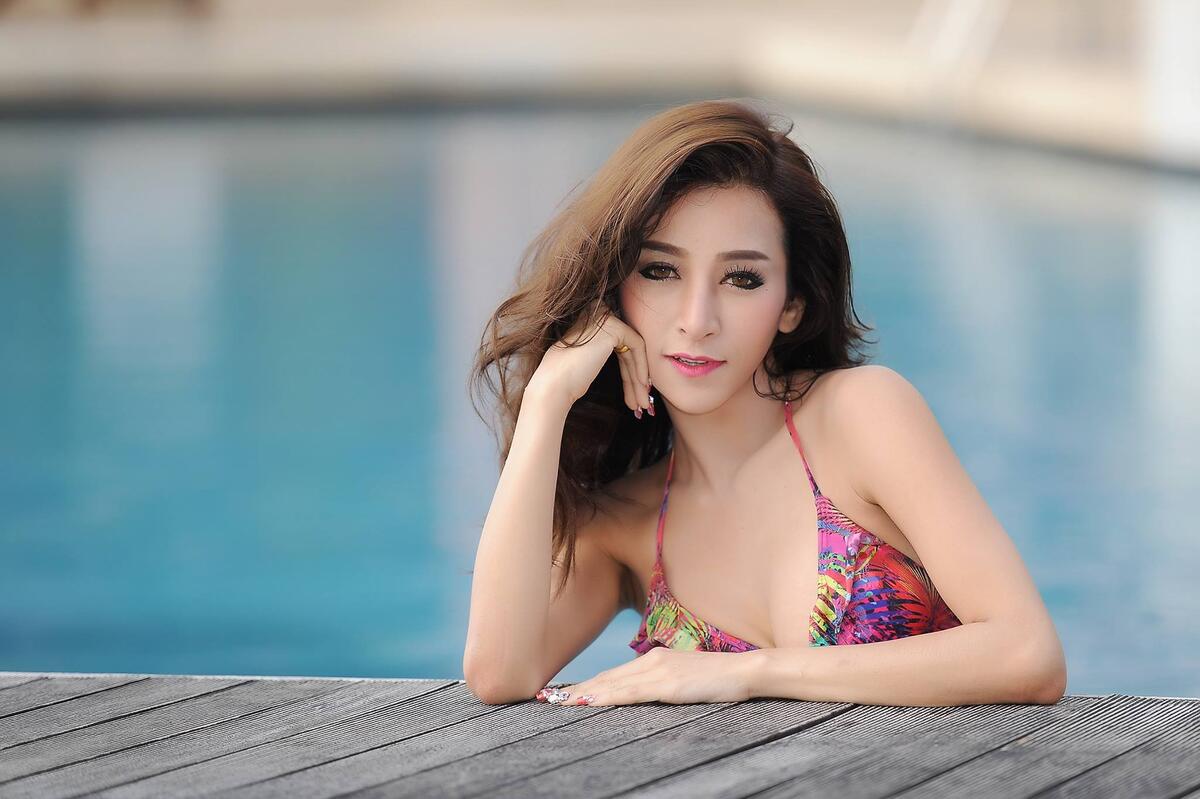 Asian woman with dark hair in the pool