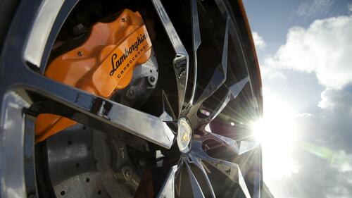 Lamborghini brake caliper in orange.