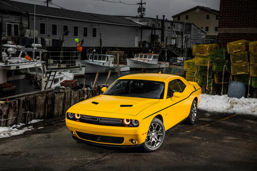 A bright yellow Dodge Challenger.