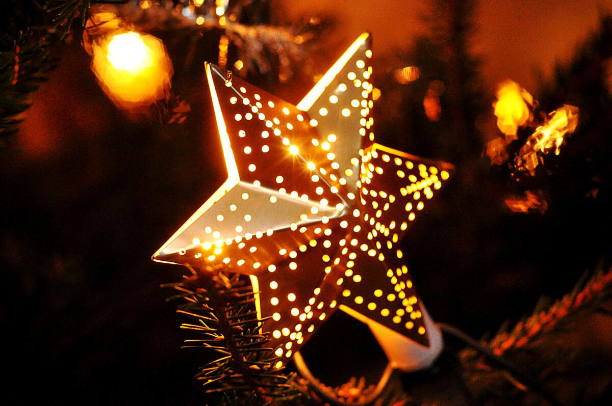 A glowing star on the Christmas tree