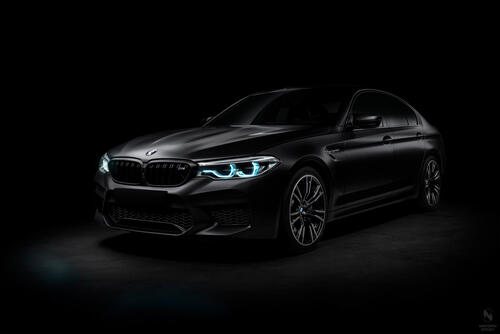 Black matte BMW M5 F90 on black background