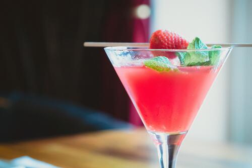 Alcoholic cocktail with strawberries