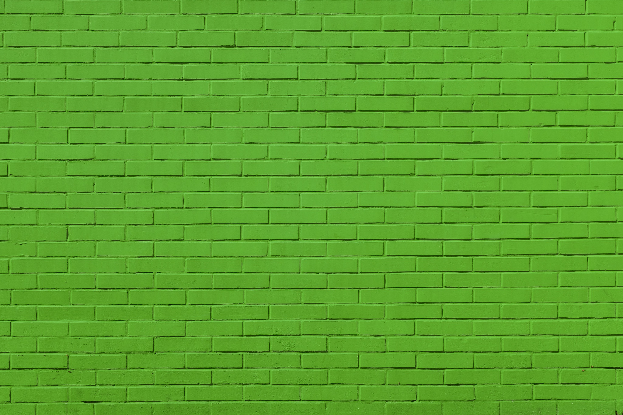 Кирпичная стена покрашенная зеленым цветом