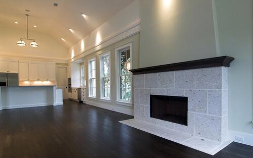 Large room with fireplace in light colors