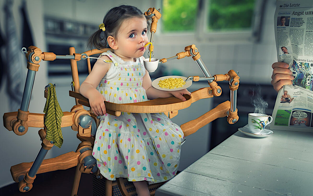 A little girl eats on a robot chair
