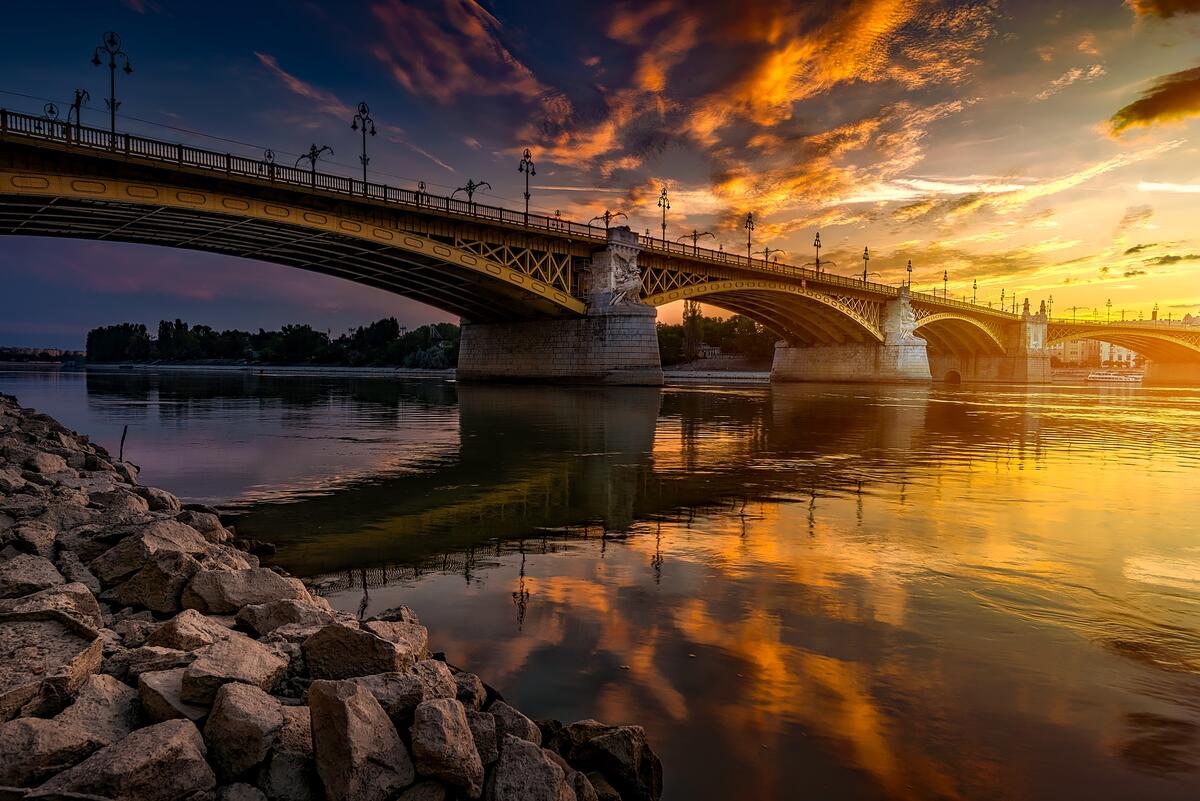 Large bridge over the river Danube at sunset