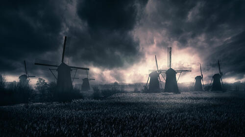 Windmills in thick clouds