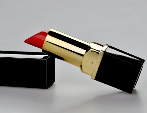Red lipstick on a plain background