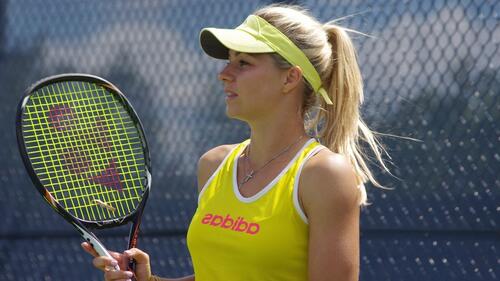 Maria Kirilenko with a tennis racket