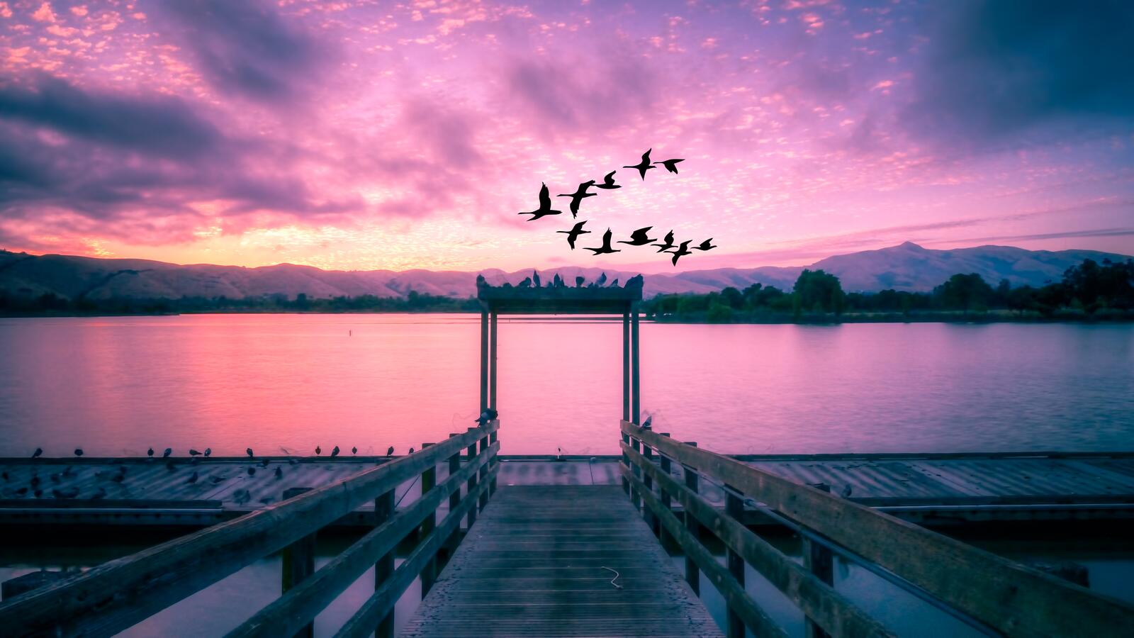Бесплатное фото Нежно-розовый закат на причале