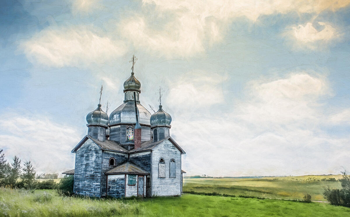 A wooden church in a field