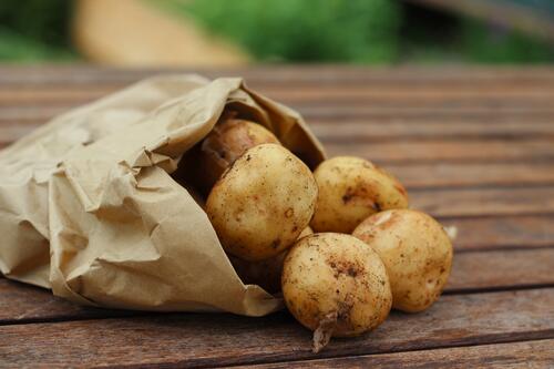 A paper bag of potatoes