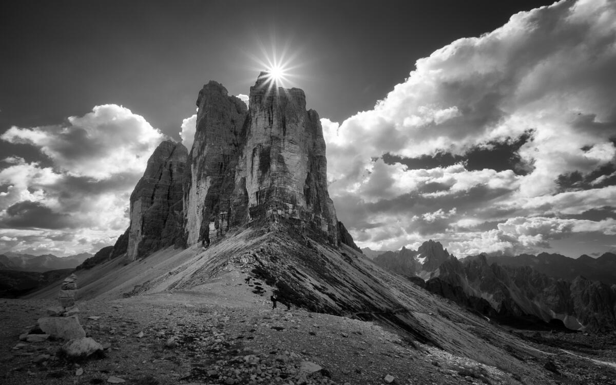 A black and white photo of a mountain in Italy