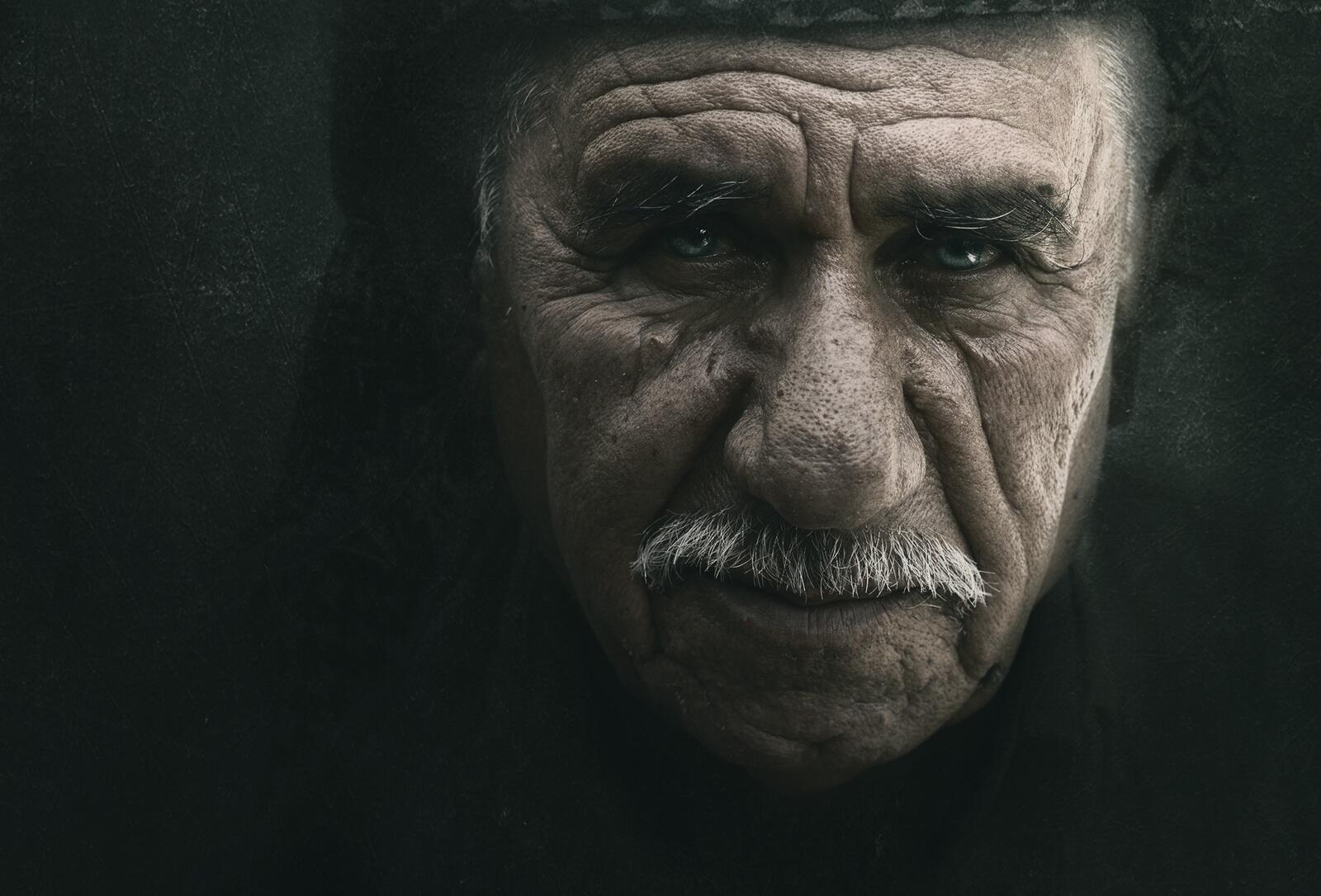 Free photo Portrait of an old man with a mustache