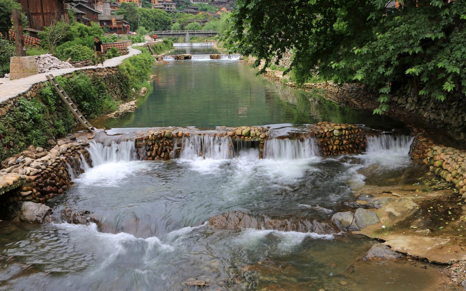 Free photo Artificial stream in the settlement