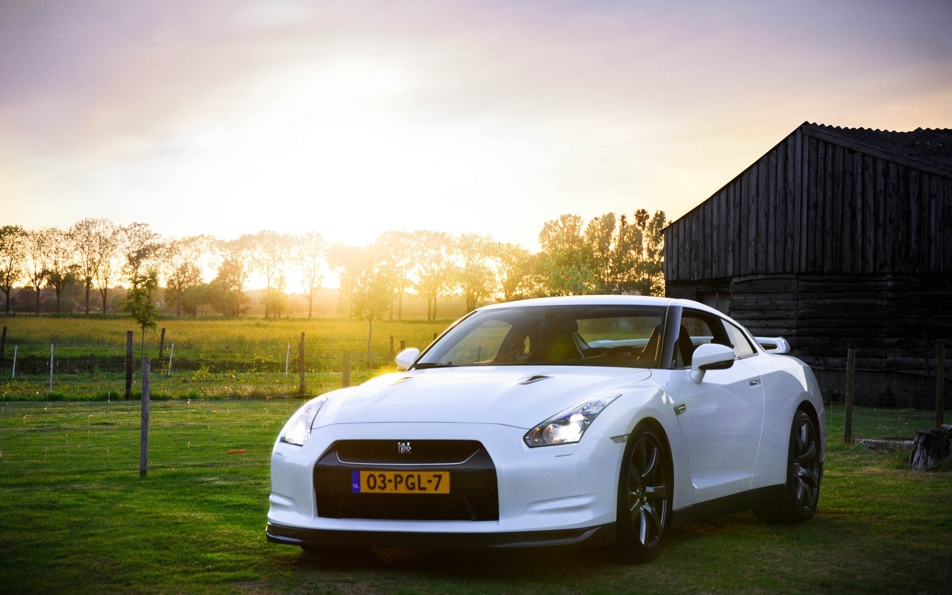 Free photo A white Nissan GTR in the village