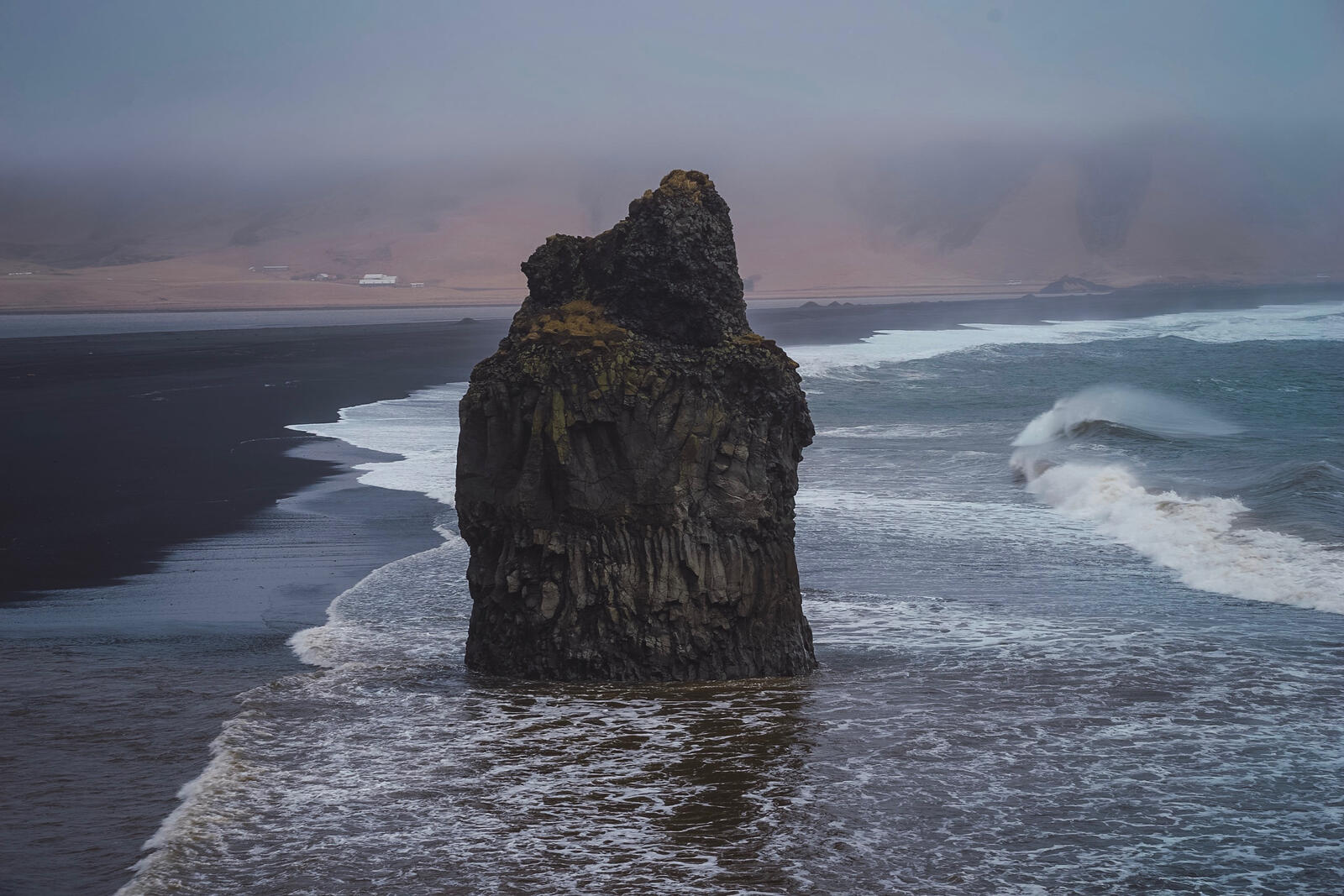 Free photo The Rock on the Sand Coast of Iceland