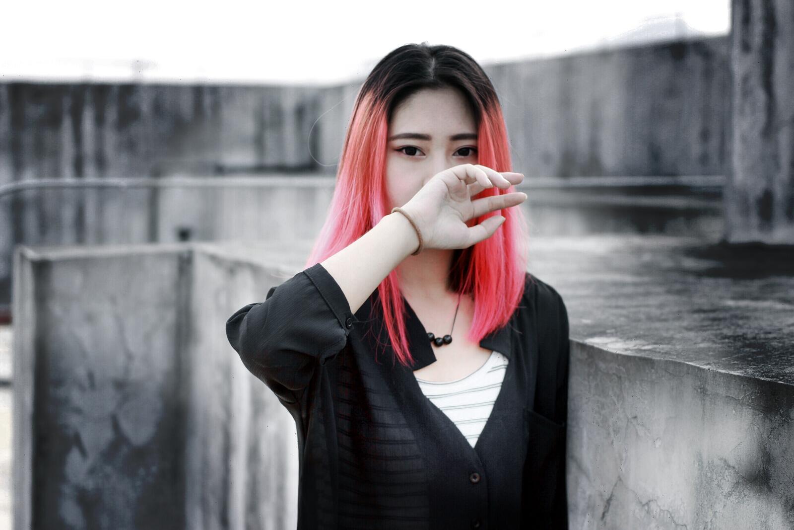 Free photo Beautiful girl with Asian looks and pink hair