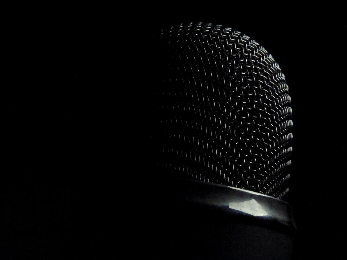Black microphone in the dark