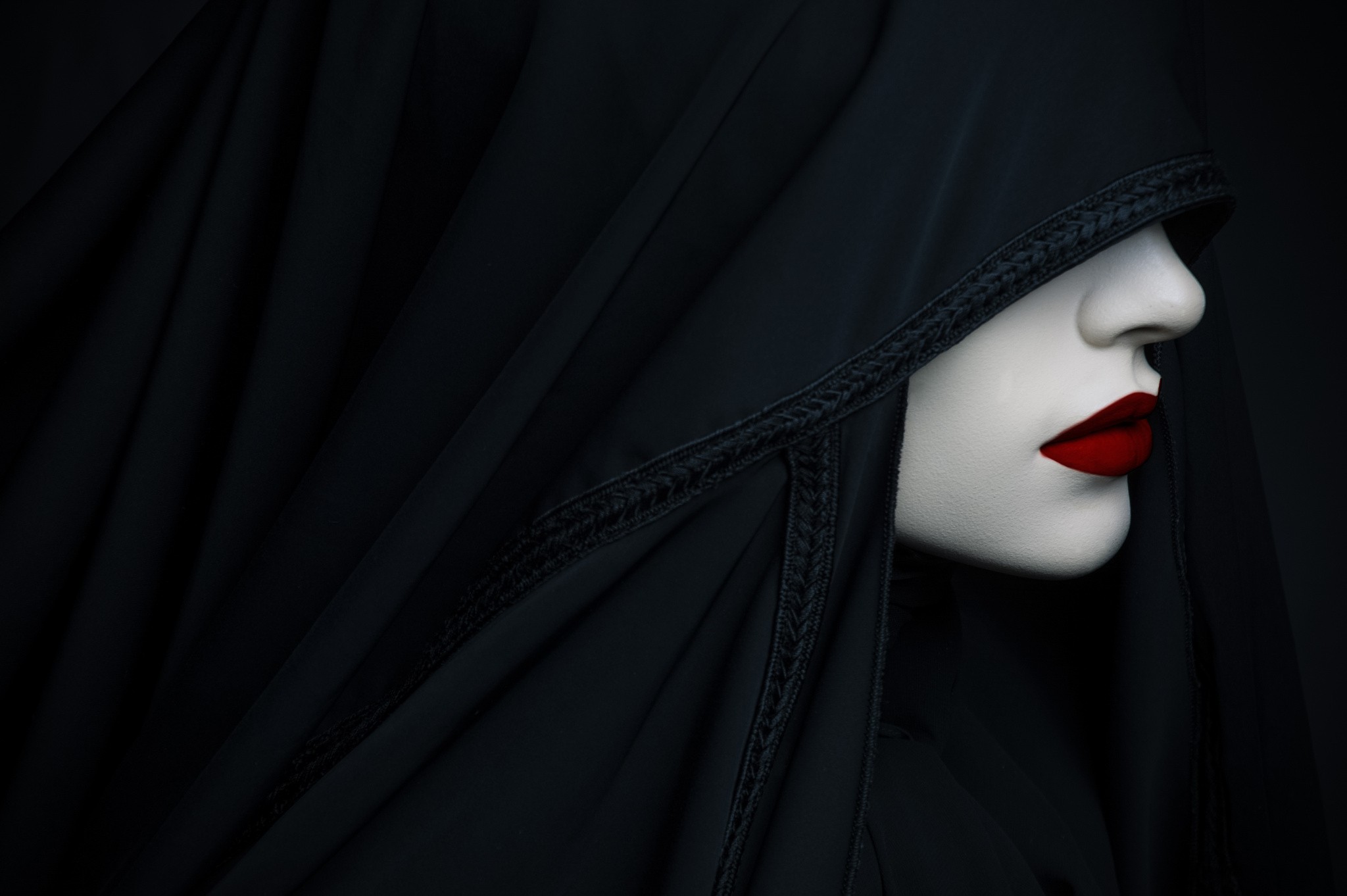 The girl in the black hoodie with the red lipstick.