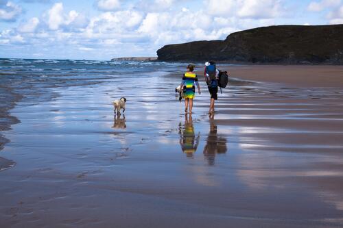 A family walk along the beach