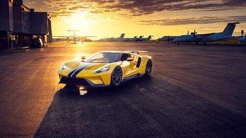 Yellow Ford GT at the airfield at sunset