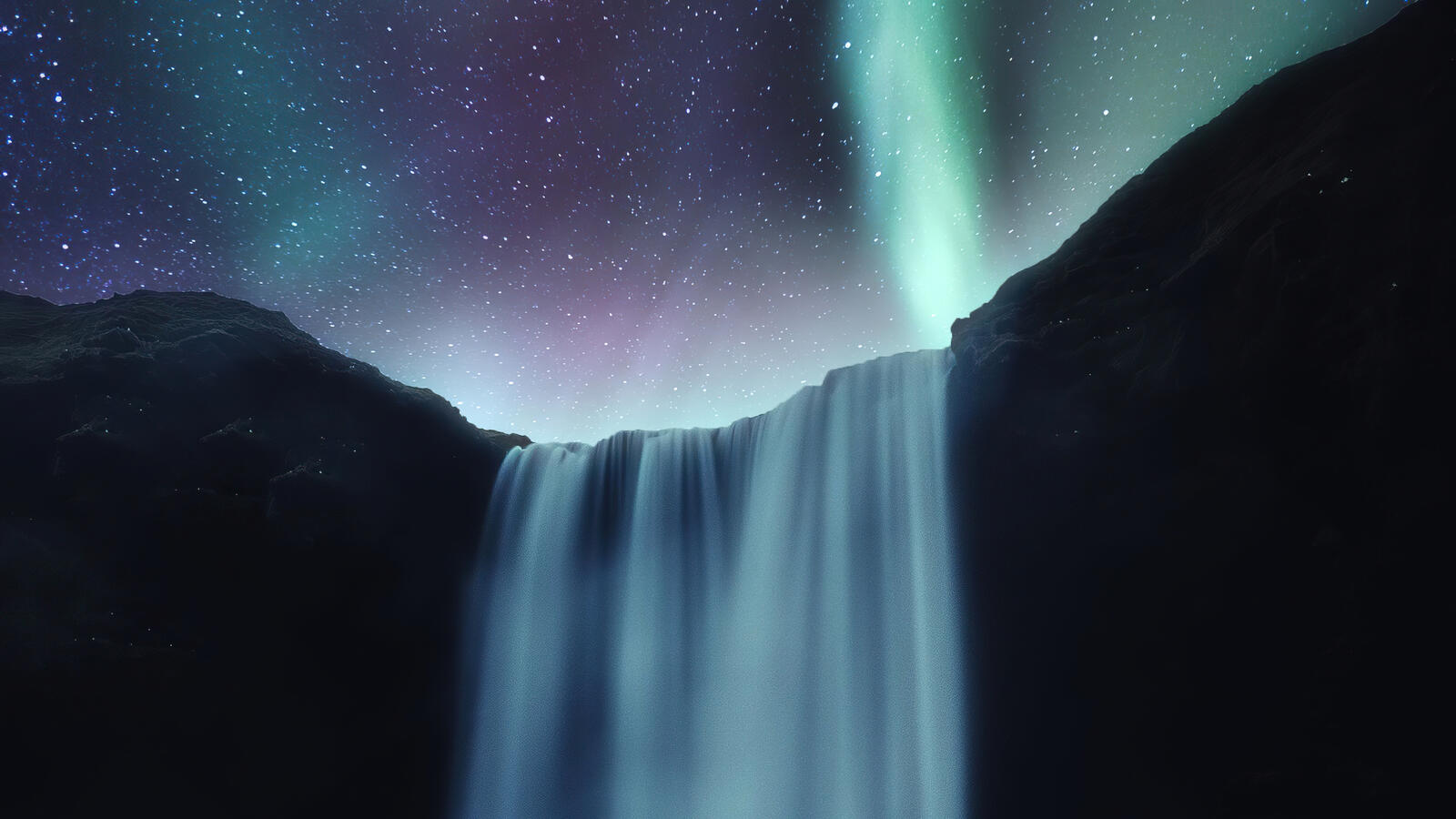 Free photo Waterfall with beautiful sky and northern lights