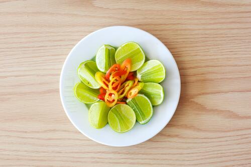 Lime slices on a white plate