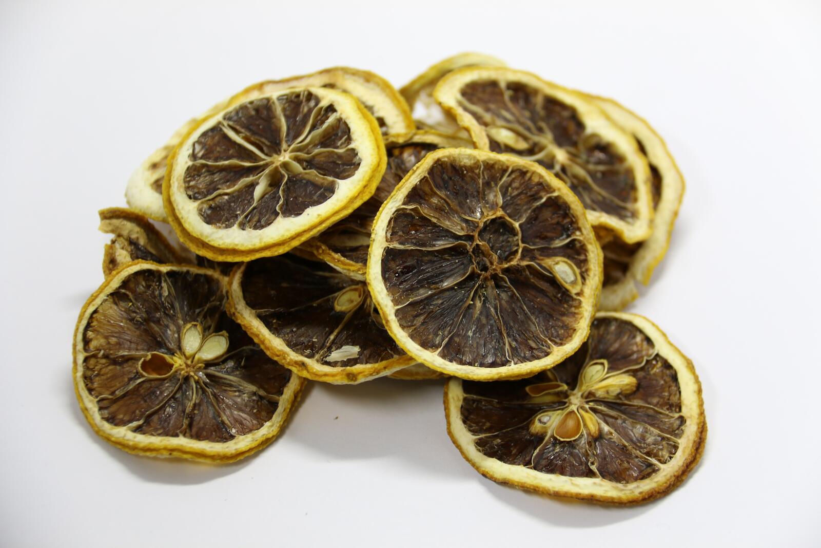 Free photo Squeezed and dried lemons on a white background
