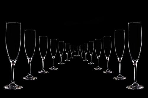 Champagne glasses on black background