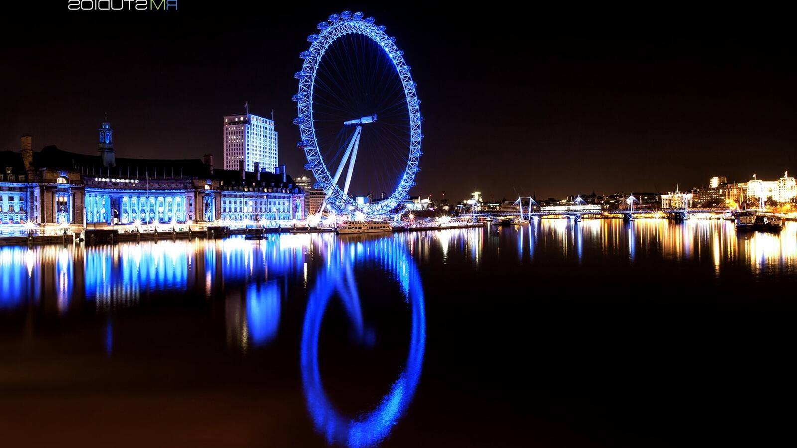 Free photo Ferris wheel with neon blue illumination
