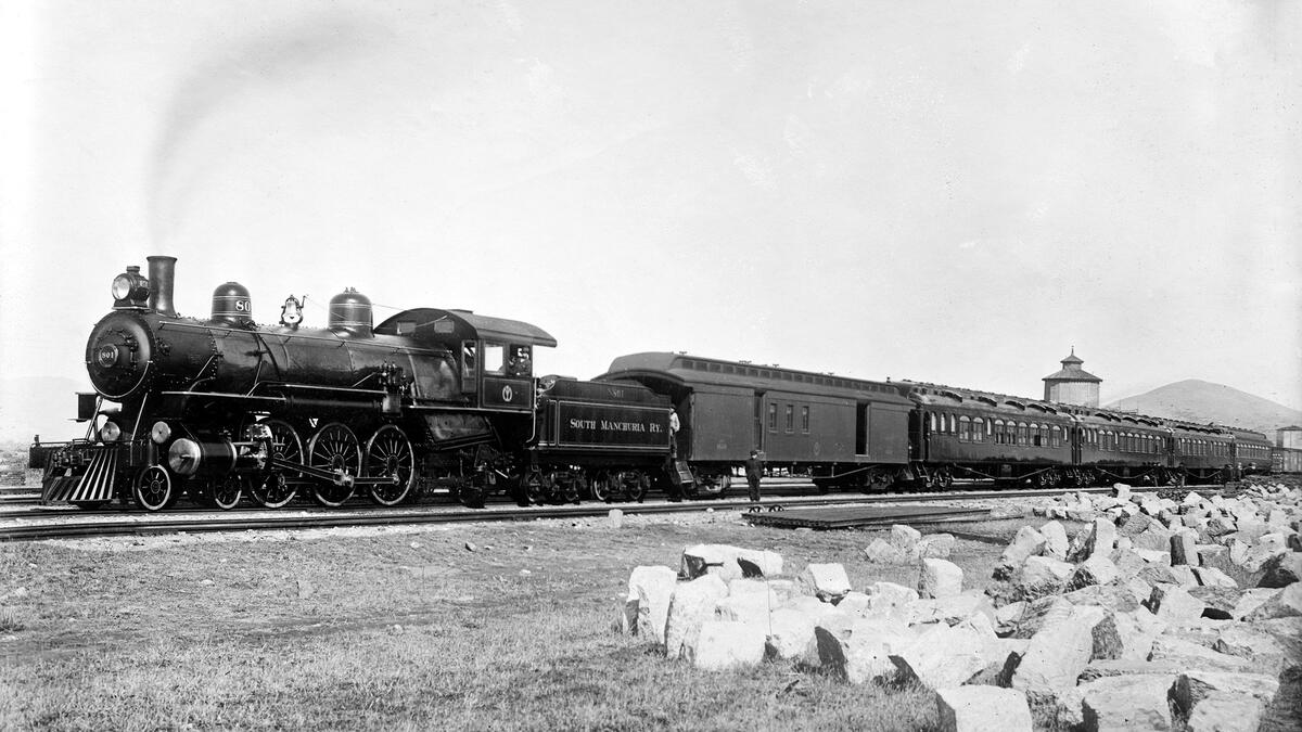 Steam locomotive in an old black and white photo