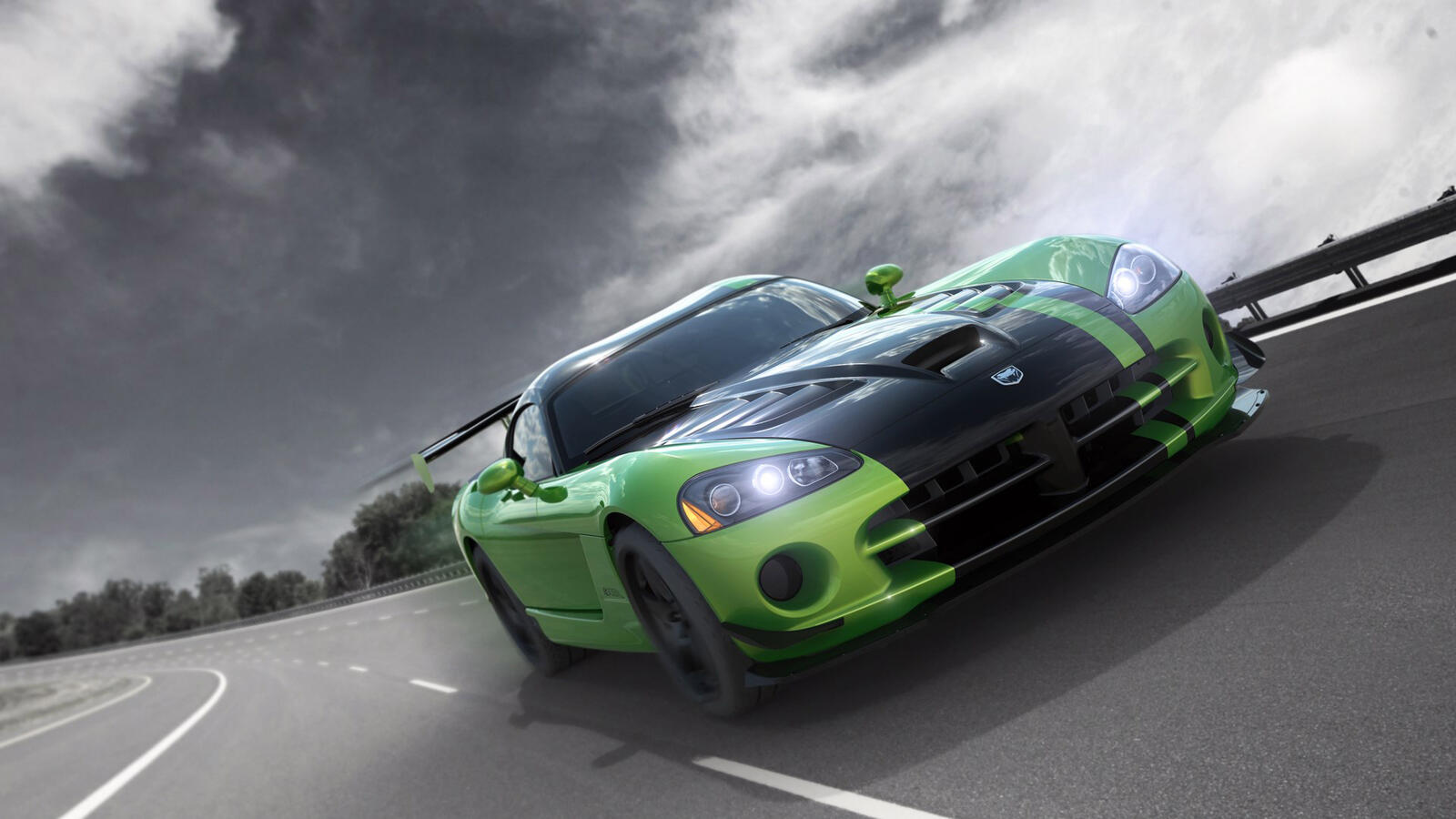 Бесплатное фото Зеленый Dodge Viper едет по дороге