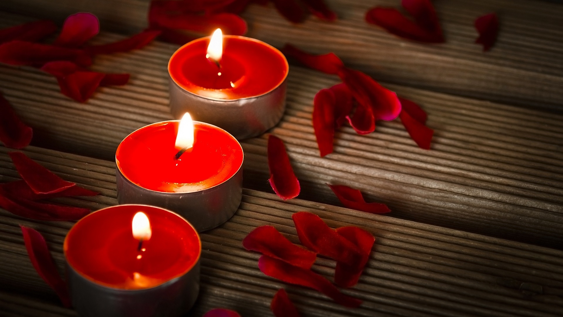 Free photo Three burning candles for Valentine`s Day