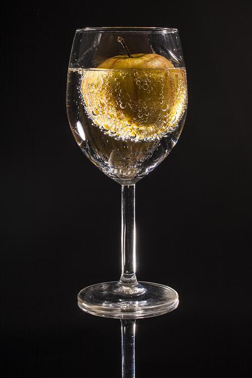 Image of an apple in a champagne glass