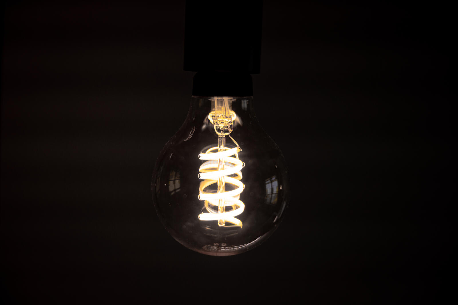 Free photo The incandescent filament in a light bulb