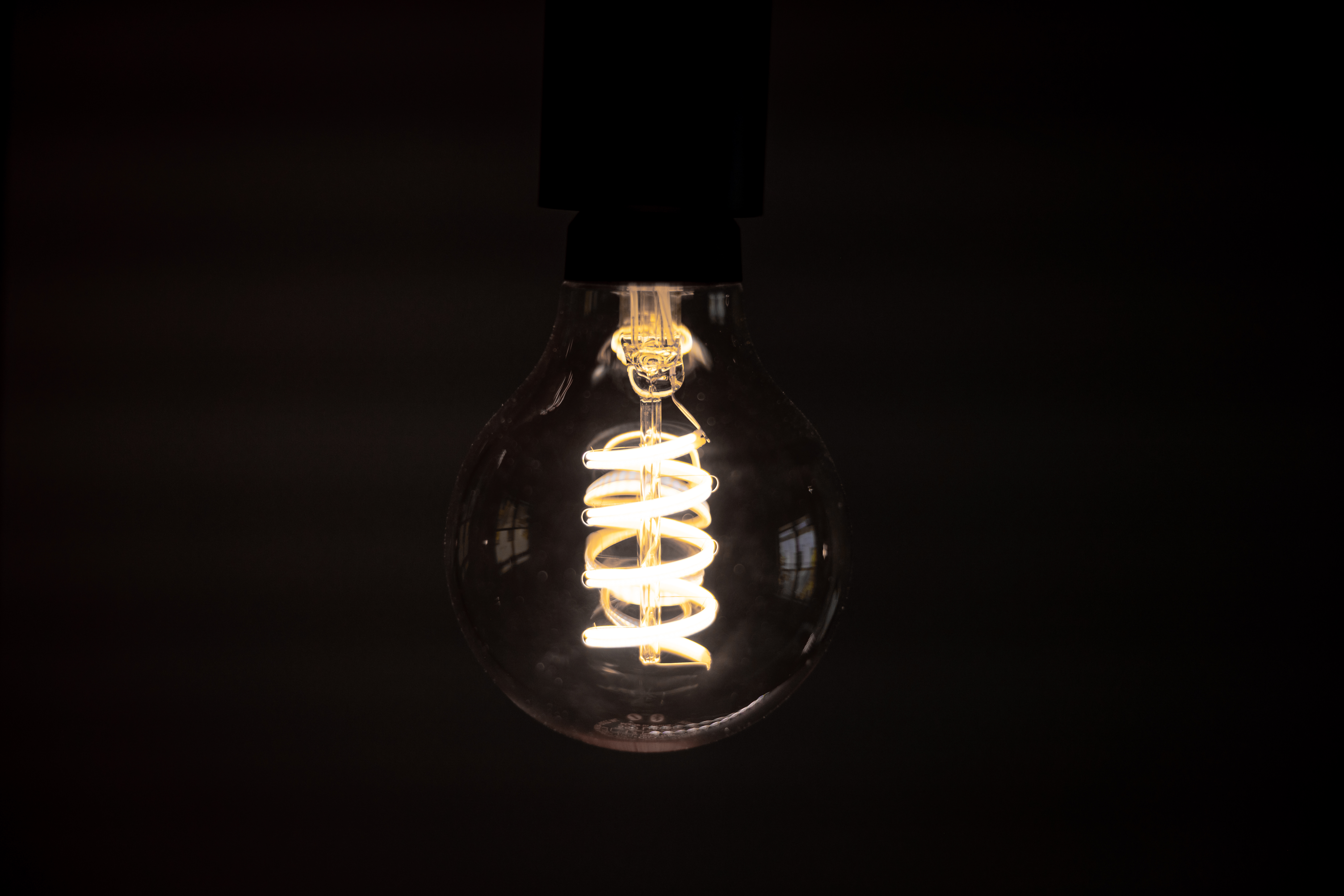 Free photo The incandescent filament in a light bulb