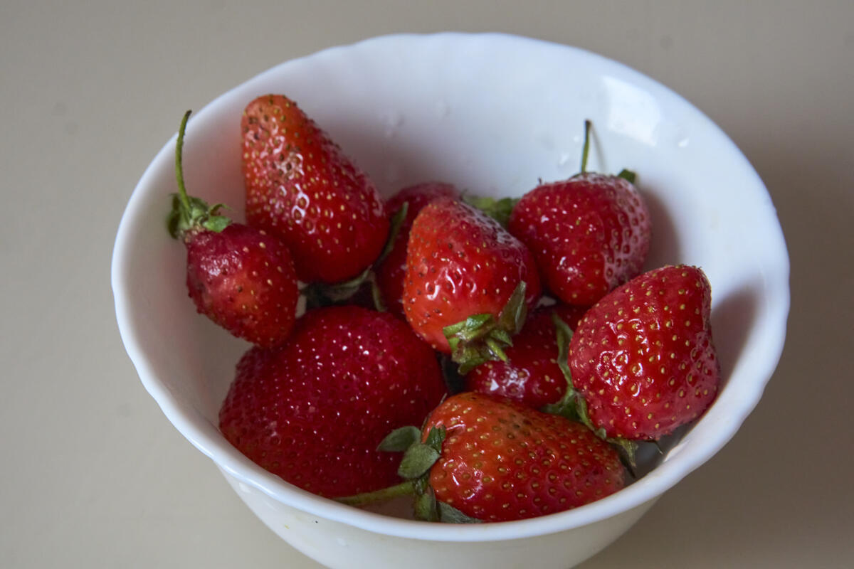 White saucer with red strawberries
