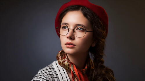 portrait of Diana Shemetova in glasses and red beret