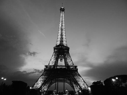A black and white photo of the Eiffel Tower in Paris