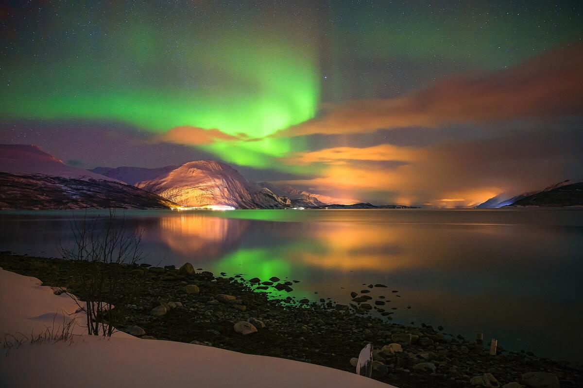 The northern lights are reflected in the lake